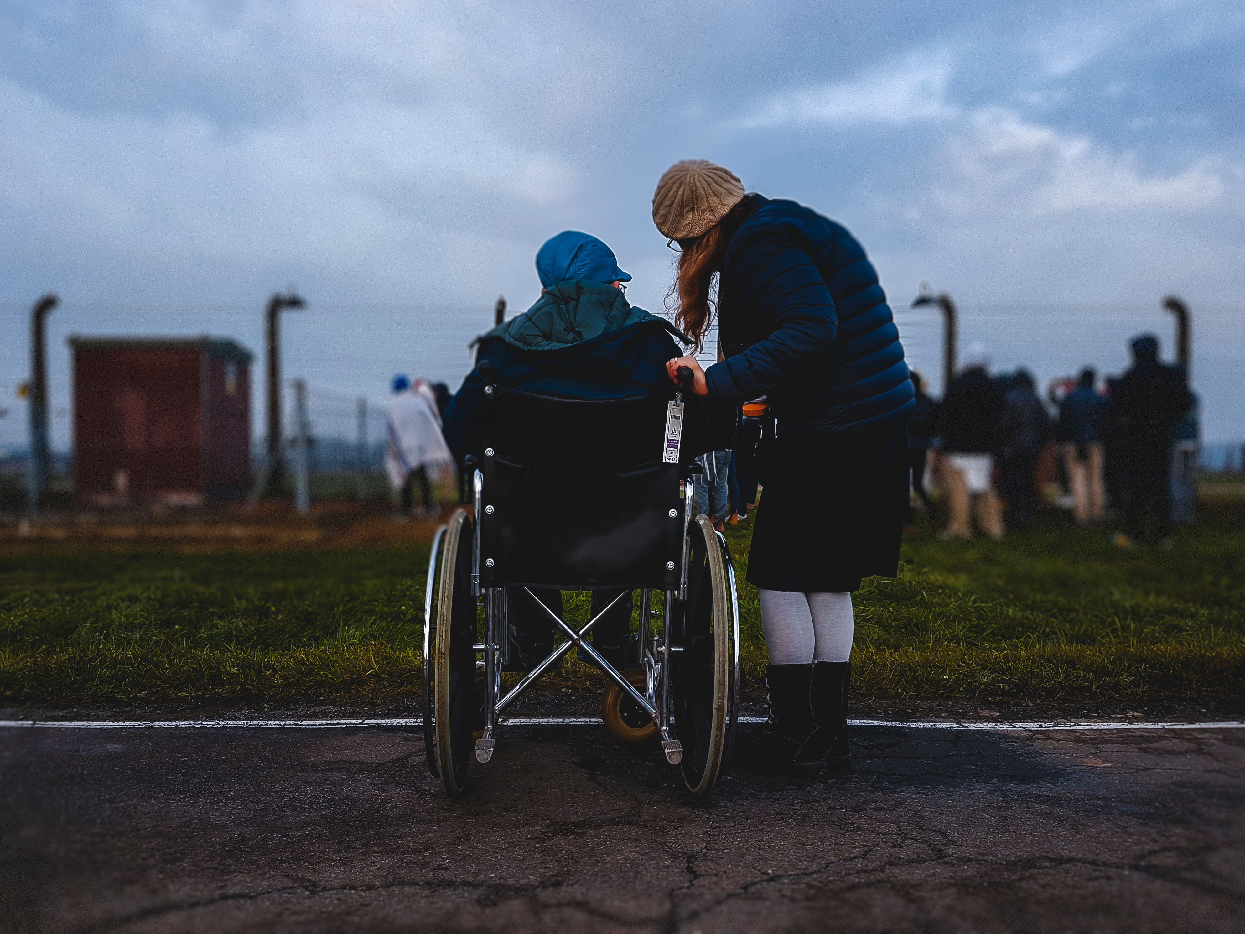 person on wheelchair with caretaker